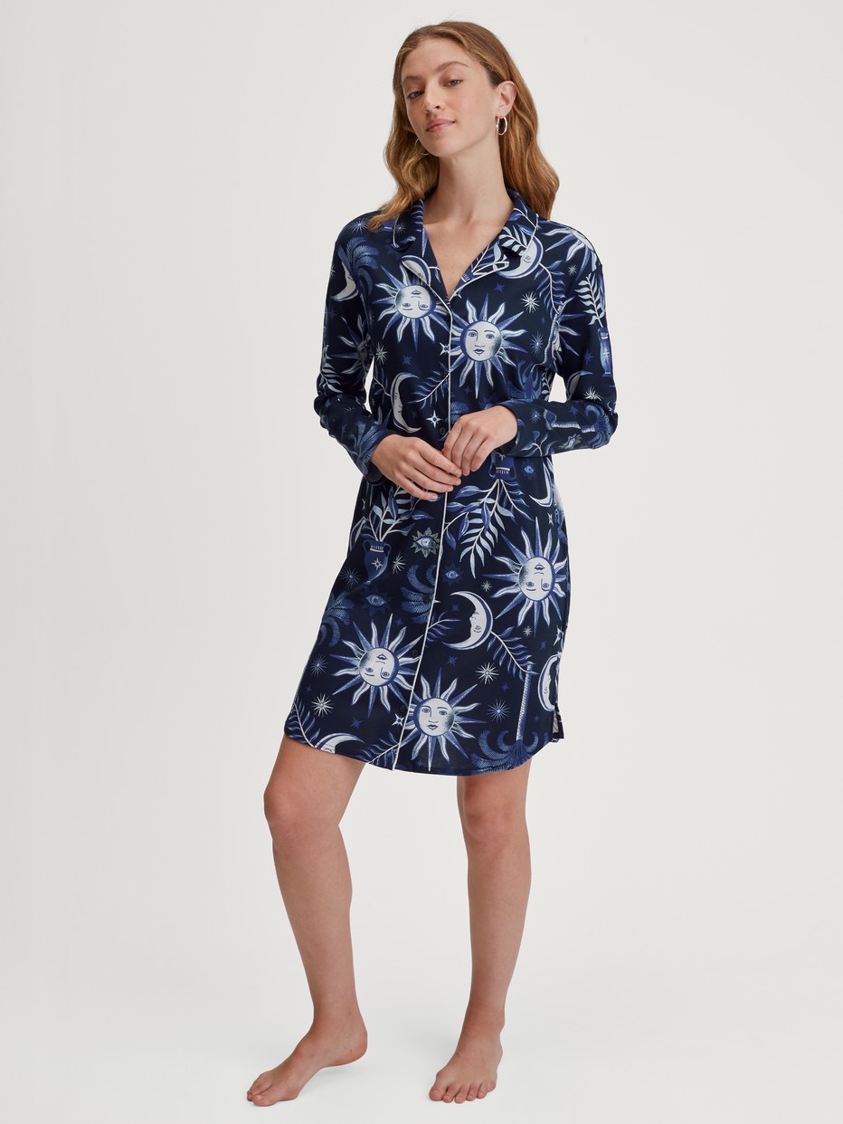 Women model is wearing Long Sleeve Nightdress – 95 cm Length made of 100% Cotton in Blue, Patterned from the Winter Dreams series by CALIDA, Front view