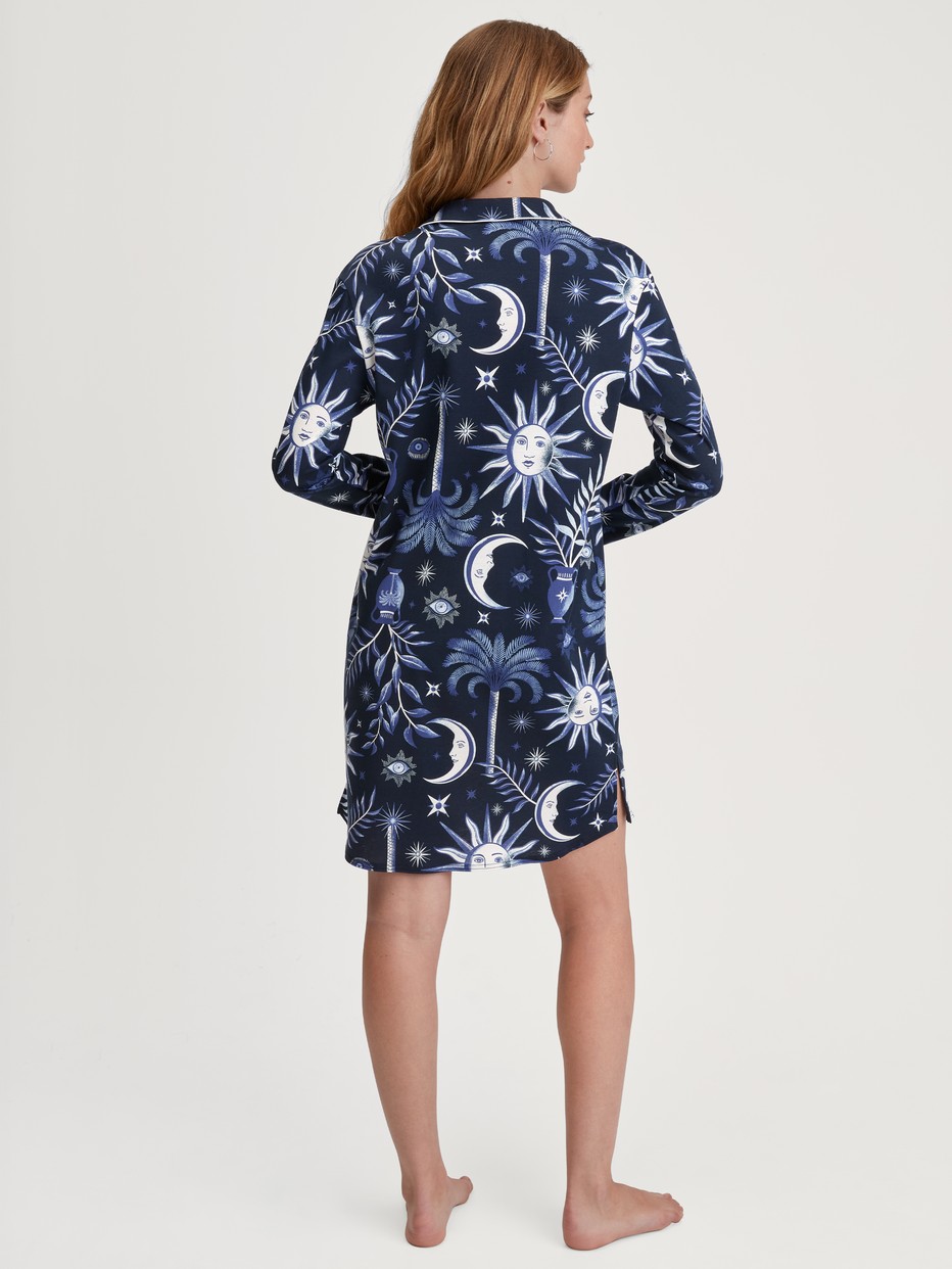 Women model is wearing Long Sleeve Nightdress – 95 cm Length made of 100% Cotton in Blue, Patterned from the Winter Dreams series by CALIDA, Back view