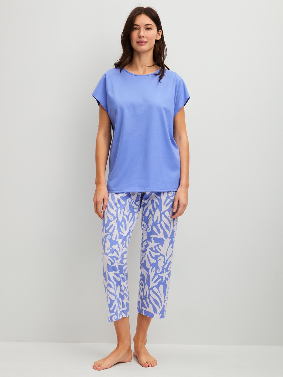 Women model is wearing 7/8 - Pyjamas made of 100% Cotton in Blue, Floral from the Cotton Special series by CALIDA, Front view