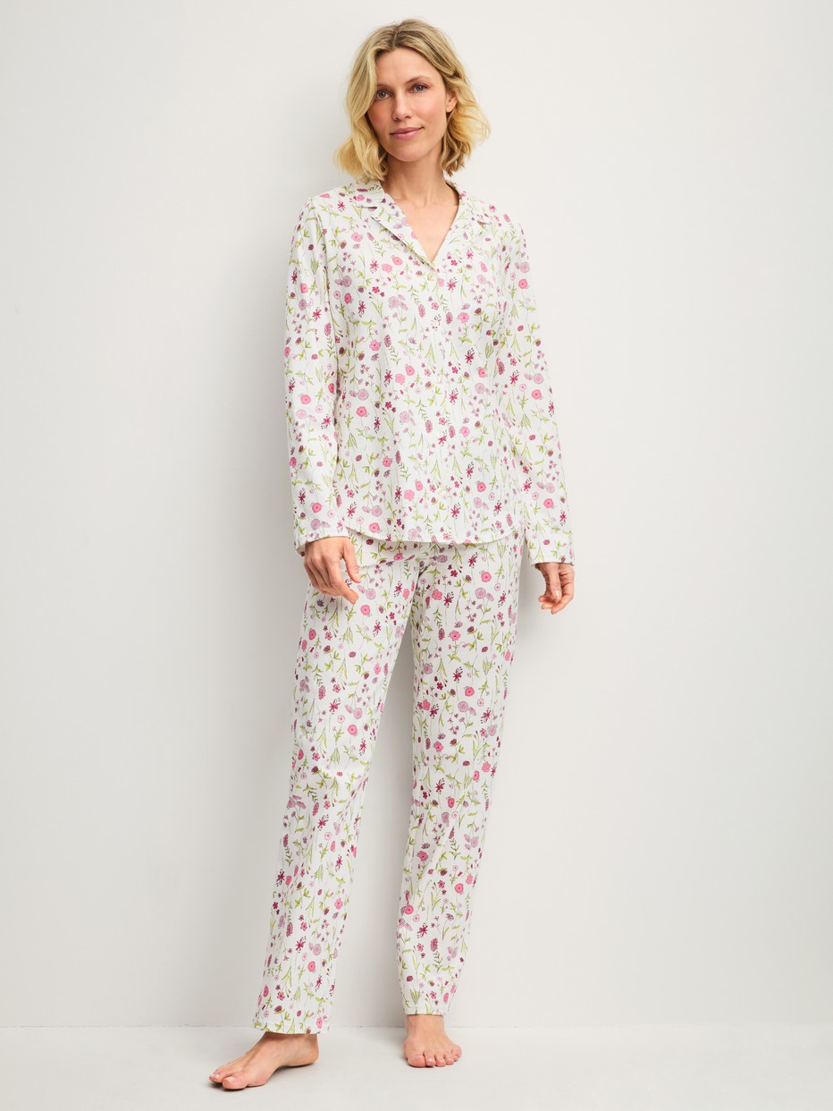 Women model is wearing Button-Up Pyjama made of 100% Cotton in Pink, Floral from the Cotton Special series by CALIDA, Front view
