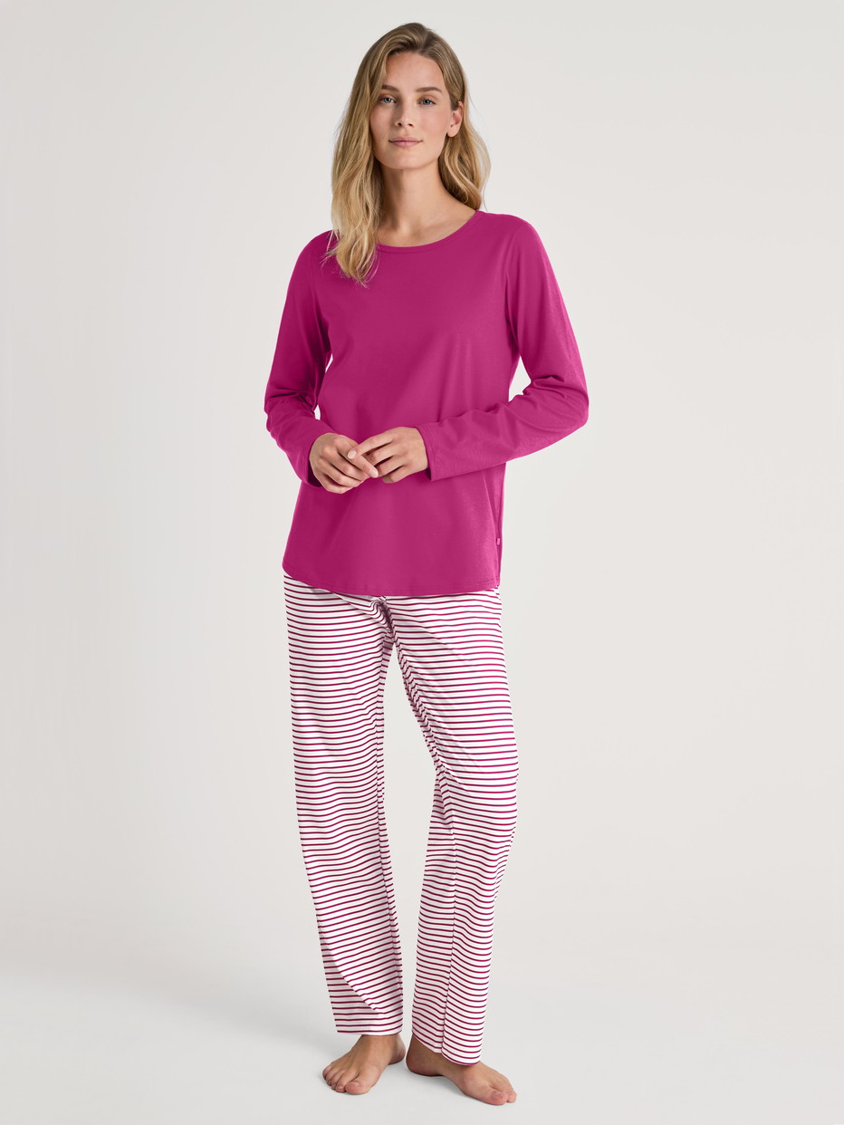 Women model is wearing Pyjamas, long made of 100% Cotton in Red, Patterned from the Cotton Special series by CALIDA, Front view
