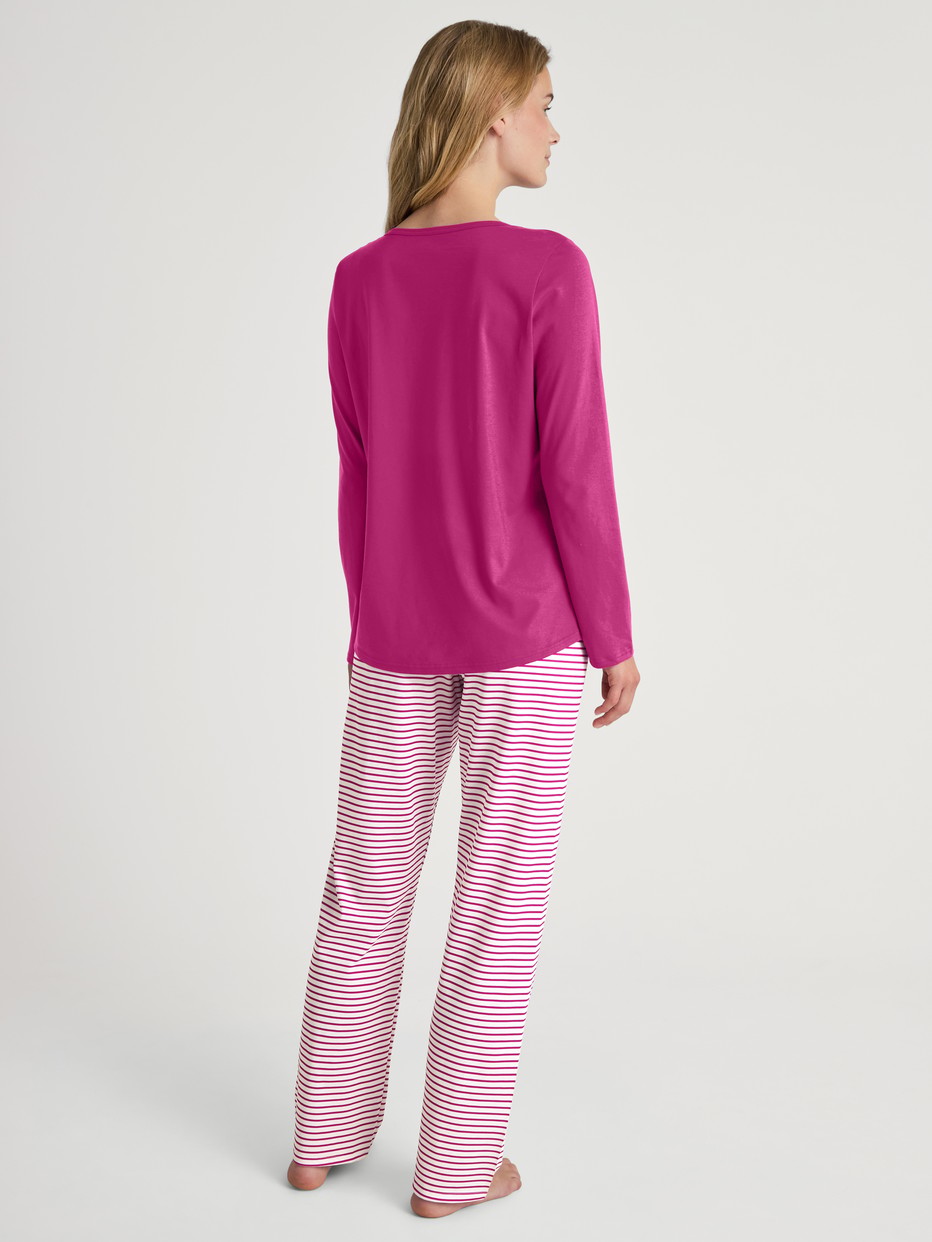 Women model is wearing Pyjamas, long made of 100% Cotton in Red, Patterned from the Cotton Special series by CALIDA, Back view
