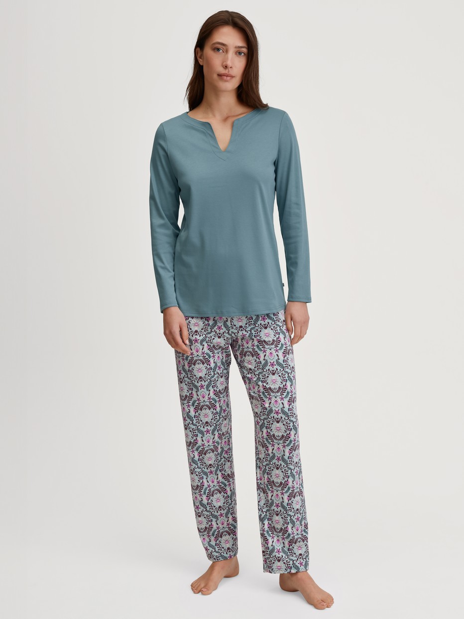 Women model is wearing Pyjamas, long made of 100% Cotton in Blue, Patterned from the Autumn Dreams series by CALIDA, Front view
