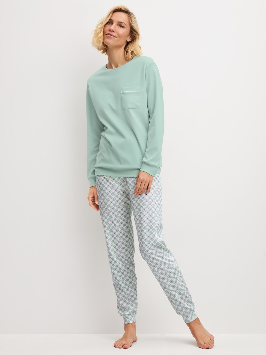 Women model is wearing Pyjama with cuff made of 100% Cotton in Turquoise, Patterned from the Sweet Dreams series by CALIDA, Front view