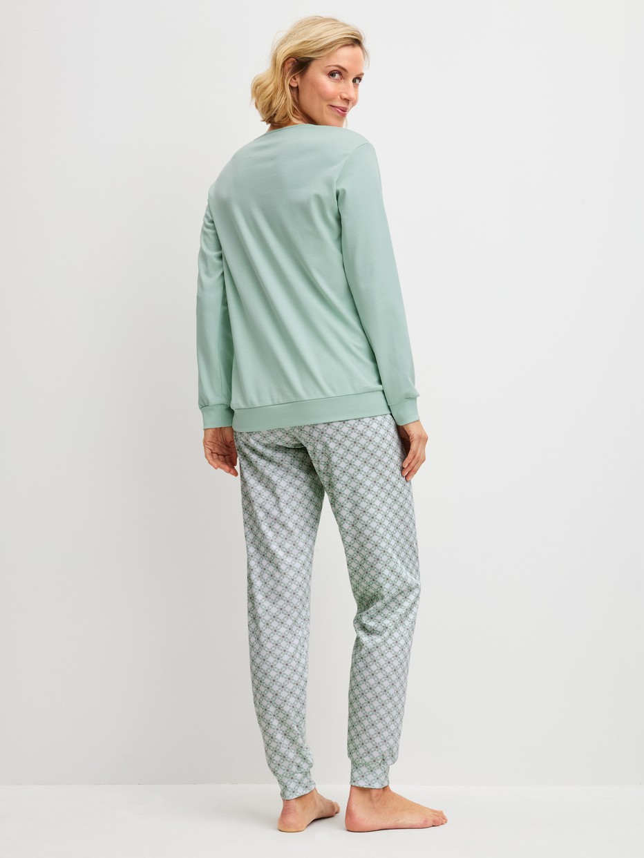 Women model is wearing Pyjama with cuff made of 100% Cotton in Turquoise, Patterned from the Sweet Dreams series by CALIDA, Back view
