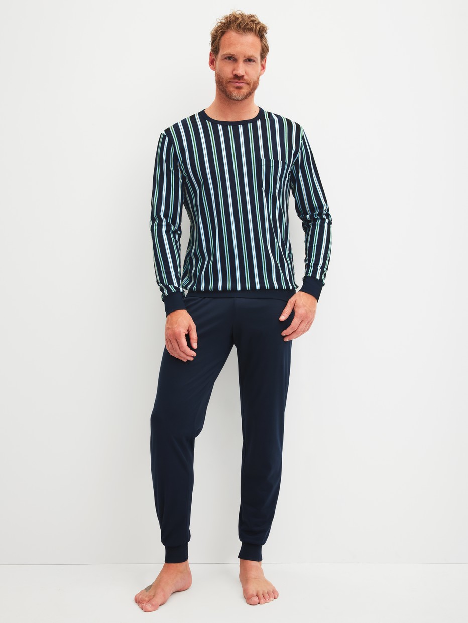Men model is wearing cuffed pyjamas made of 100% Cotton in Blue, Striped from the Relax Choice series by CALIDA, Front view