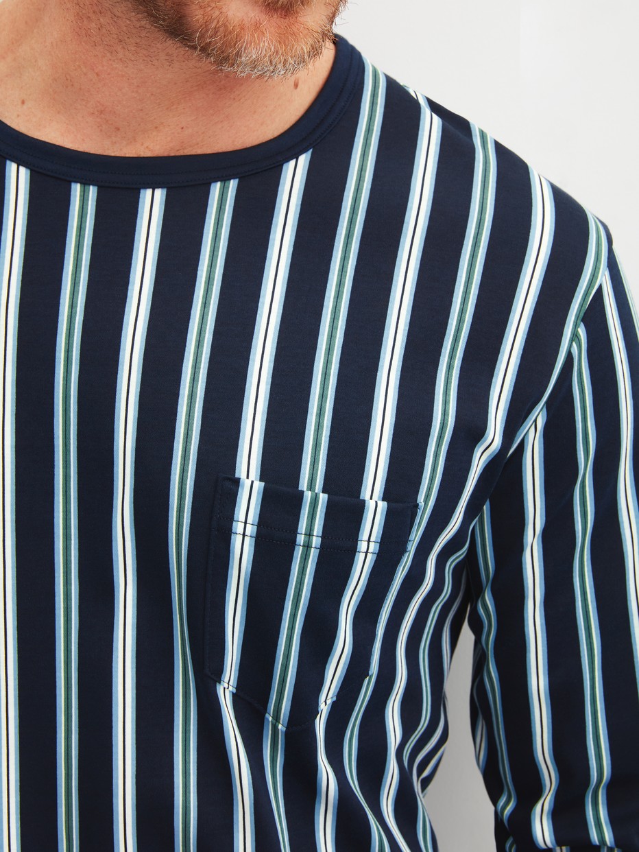 Men model is wearing cuffed pyjamas made of 100% Cotton in Blue, Striped from the Relax Choice series by CALIDA, Detail