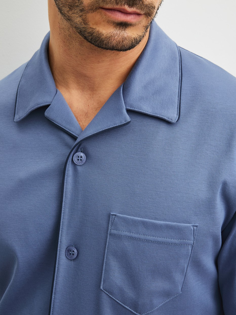 Men model is wearing Pyjamas with buttons made of 100% Cotton in Blue, Unicoloured from the Relax Choice 1 series by CALIDA, Detail
