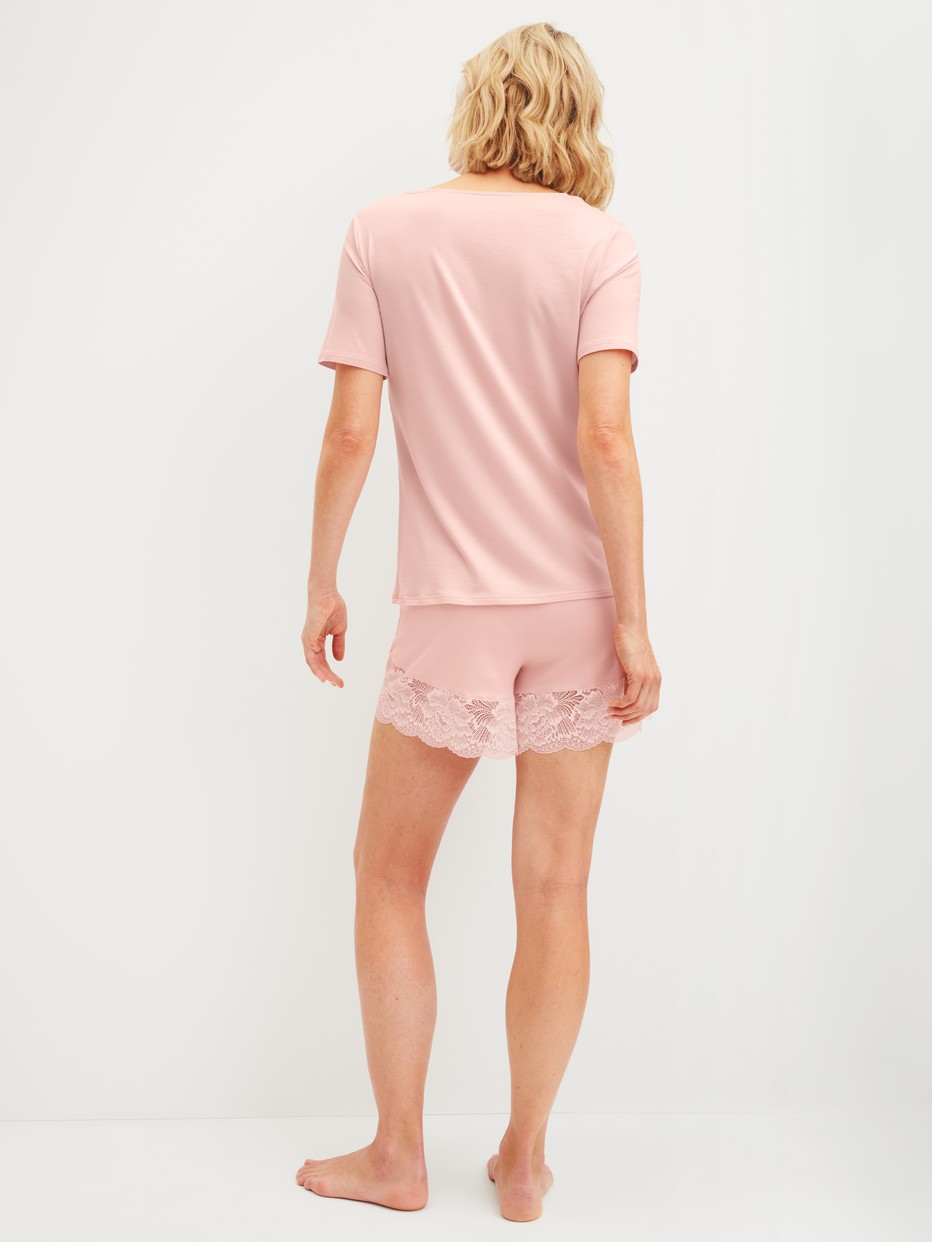 Women model is wearing Short pyjama made of Modal in Pink, Lace from the Elegant Dreams series by CALIDA, Back view