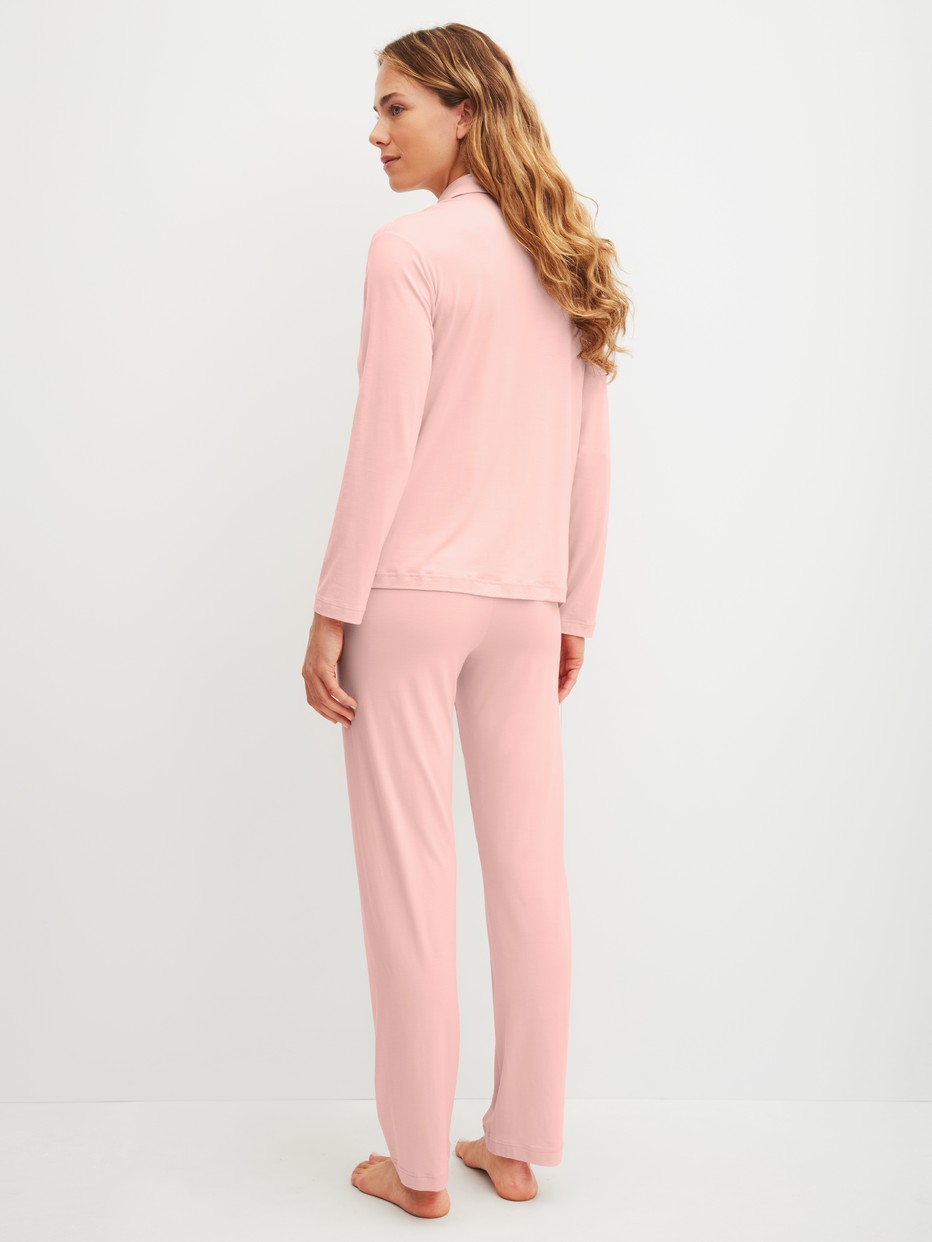 Women model is wearing Button-Up Pyjama made of Modal in Pink, Unicoloured from the Balancing Dreams series by CALIDA, Back view