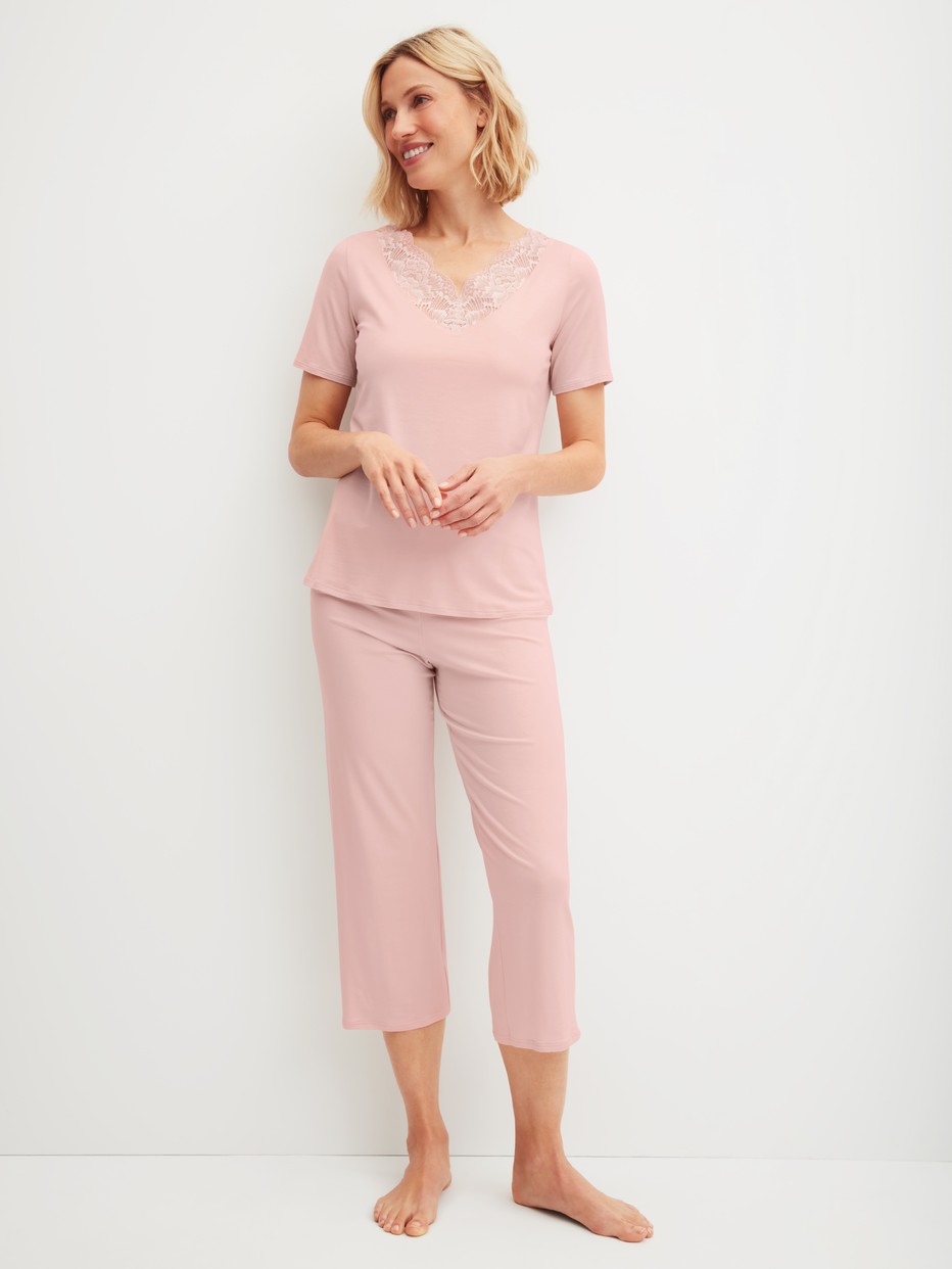 Women model is wearing 7/8 - Pyjamas made of Modal in Pink, Lace from the Elegant Dreams series by CALIDA, Front view