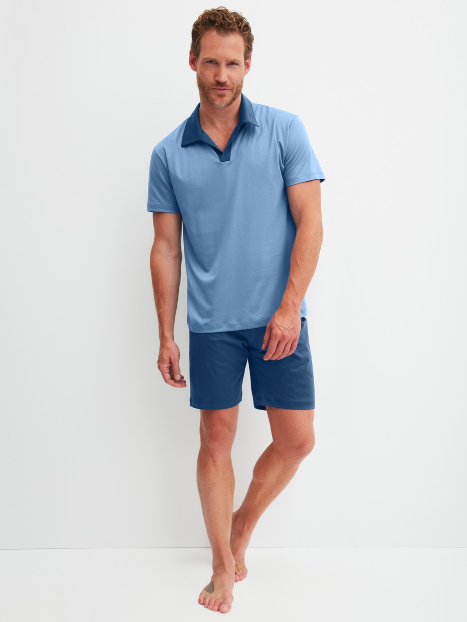 Men model is wearing Short pyjama made of Cotton in Blue, Unicoloured from the Relax Superlight series by CALIDA, Front view