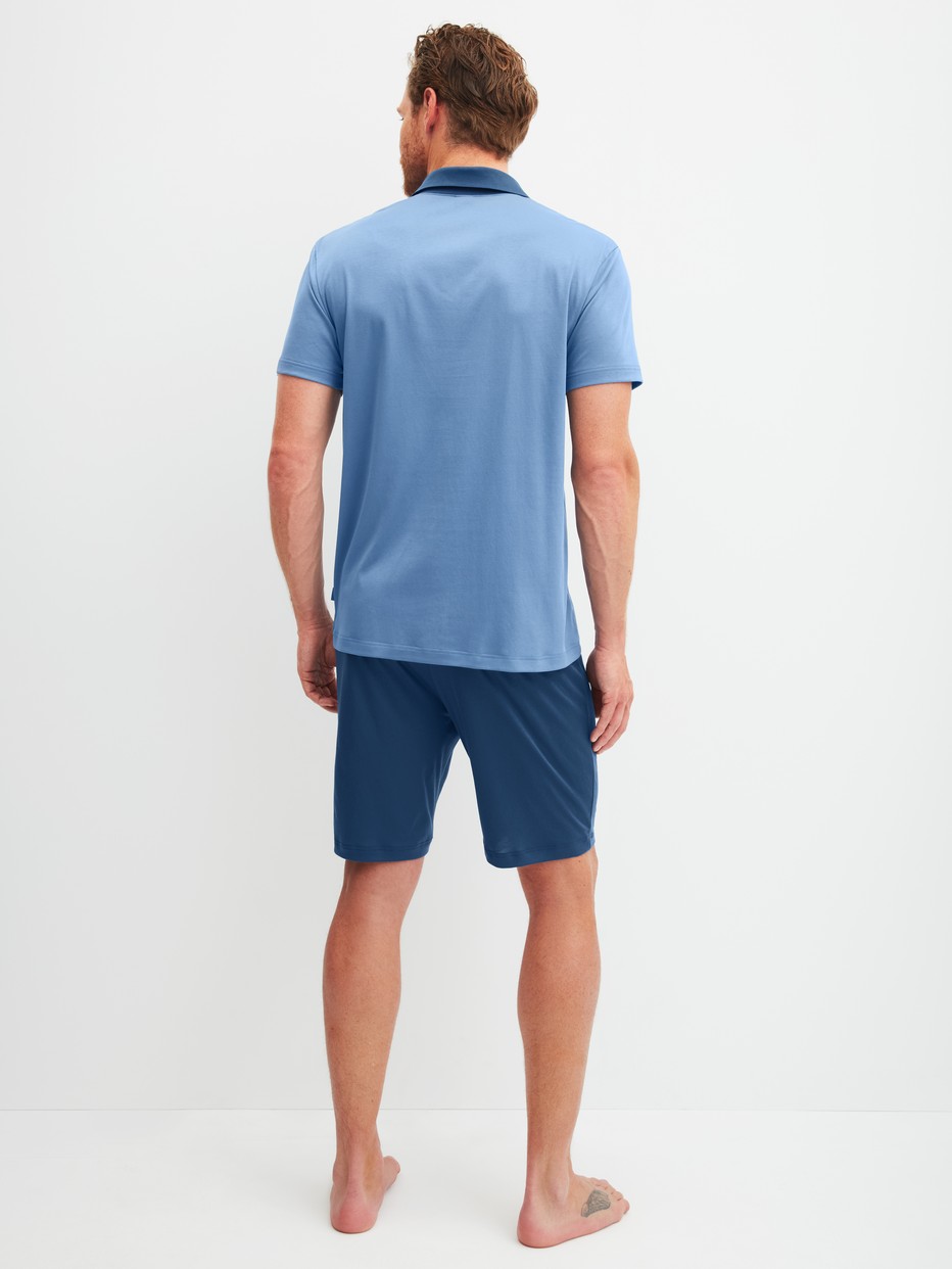 Men model is wearing Short pyjama made of Cotton in Blue, Unicoloured from the Relax Superlight series by CALIDA, Back view