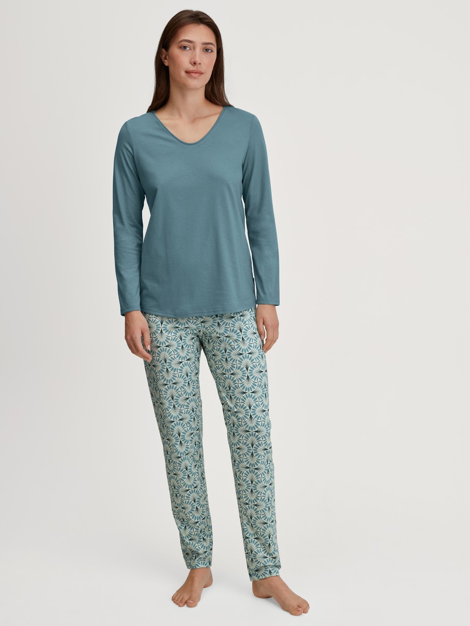 Women model is wearing Pyjamas, long made of 100% Cotton in Blue, Patterned from the Ornament Nights series by CALIDA, Front view