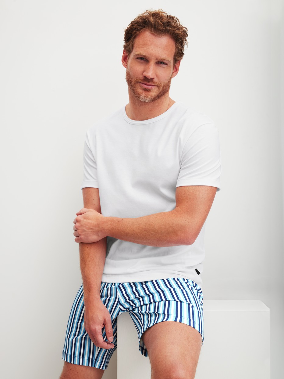 Men model is wearing Short pyjama made of 100% Cotton in Blue, Striped from the Relax Streamline 4 series by CALIDA, Additional Image