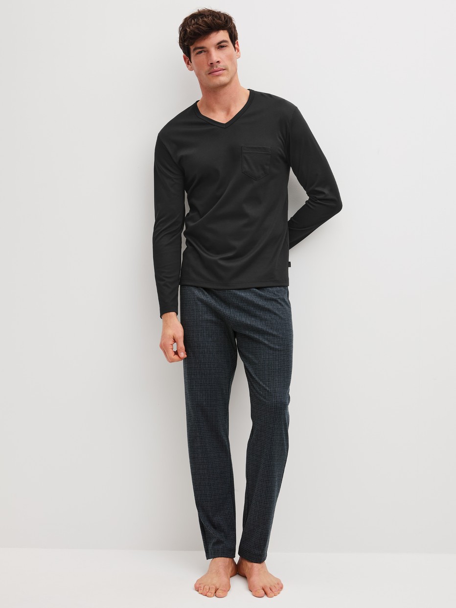 Men model is wearing Pyjamas, long made of 100% Cotton in Black, Patterned from the Relax Streamline 2 series by CALIDA, Front view