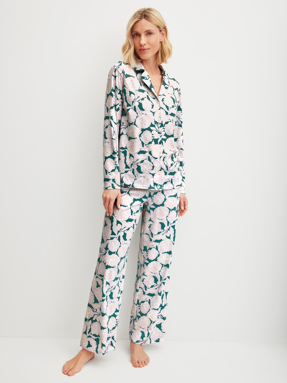 Women model is wearing Button-Up Pyjama made of 100% Cotton in Turquoise, Floral from the Botanic Dreams series by CALIDA, Front view