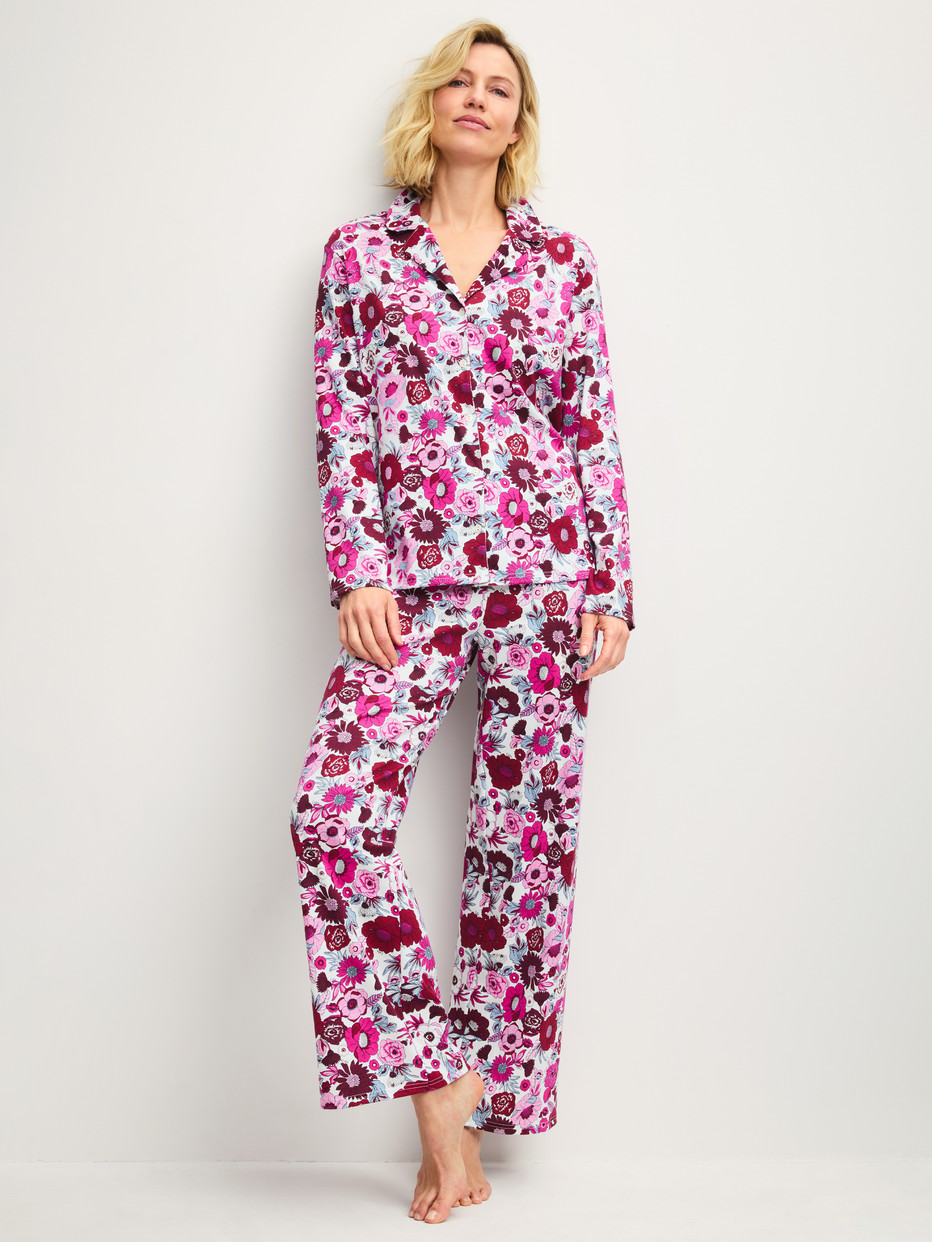 Women model is wearing Button-Up Pyjama made of 100% Cotton in Red, Floral from the Season Special series by CALIDA, Front view