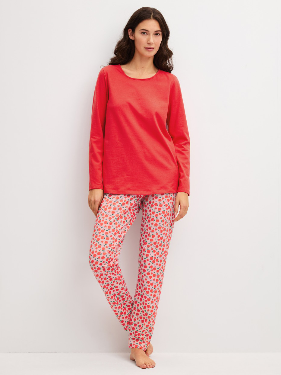 Women model is wearing Pyjamas, long made of 100% Cotton in Red, Patterned from the Fruity Dreams series by CALIDA, Front view