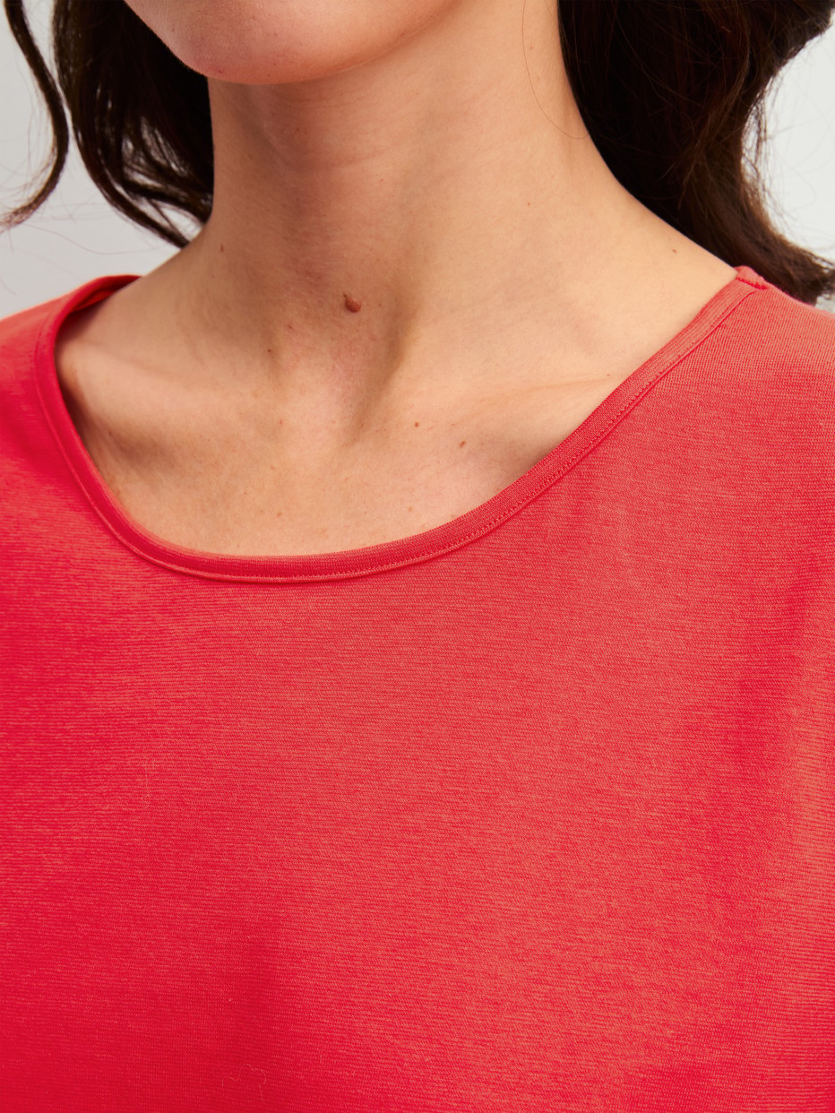 Women model is wearing Pyjamas, long made of 100% Cotton in Red, Patterned from the Fruity Dreams series by CALIDA, Detail