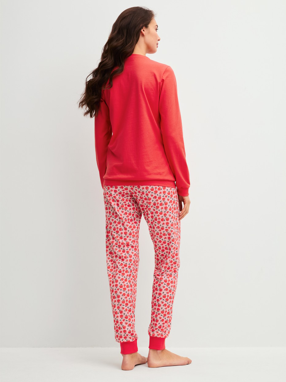 Women model is wearing Pyjama with cuff made of 100% Cotton in Red, Patterned from the Fruity Dreams series by CALIDA, Back view