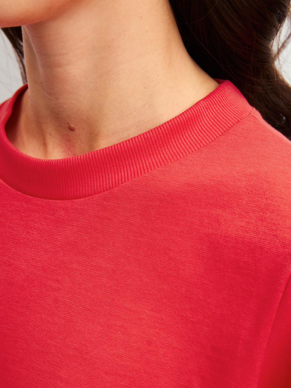 Women model is wearing Pyjama with cuff made of 100% Cotton in Red, Patterned from the Fruity Dreams series by CALIDA, Detail