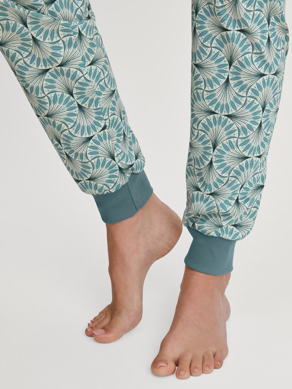 Women model is wearing Pyjama with cuff made of 100% Cotton in Blue, Patterned from the Ornament Nights series by CALIDA, Detail