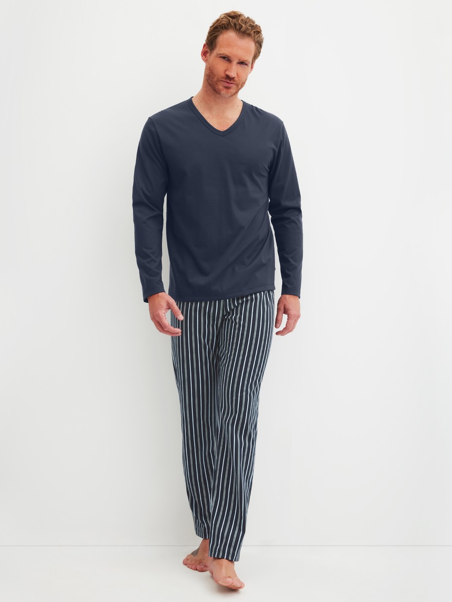 Men model is wearing Pyjamas, long made of 100% Cotton in Blue,  from the Cotton Special series by CALIDA, Front view