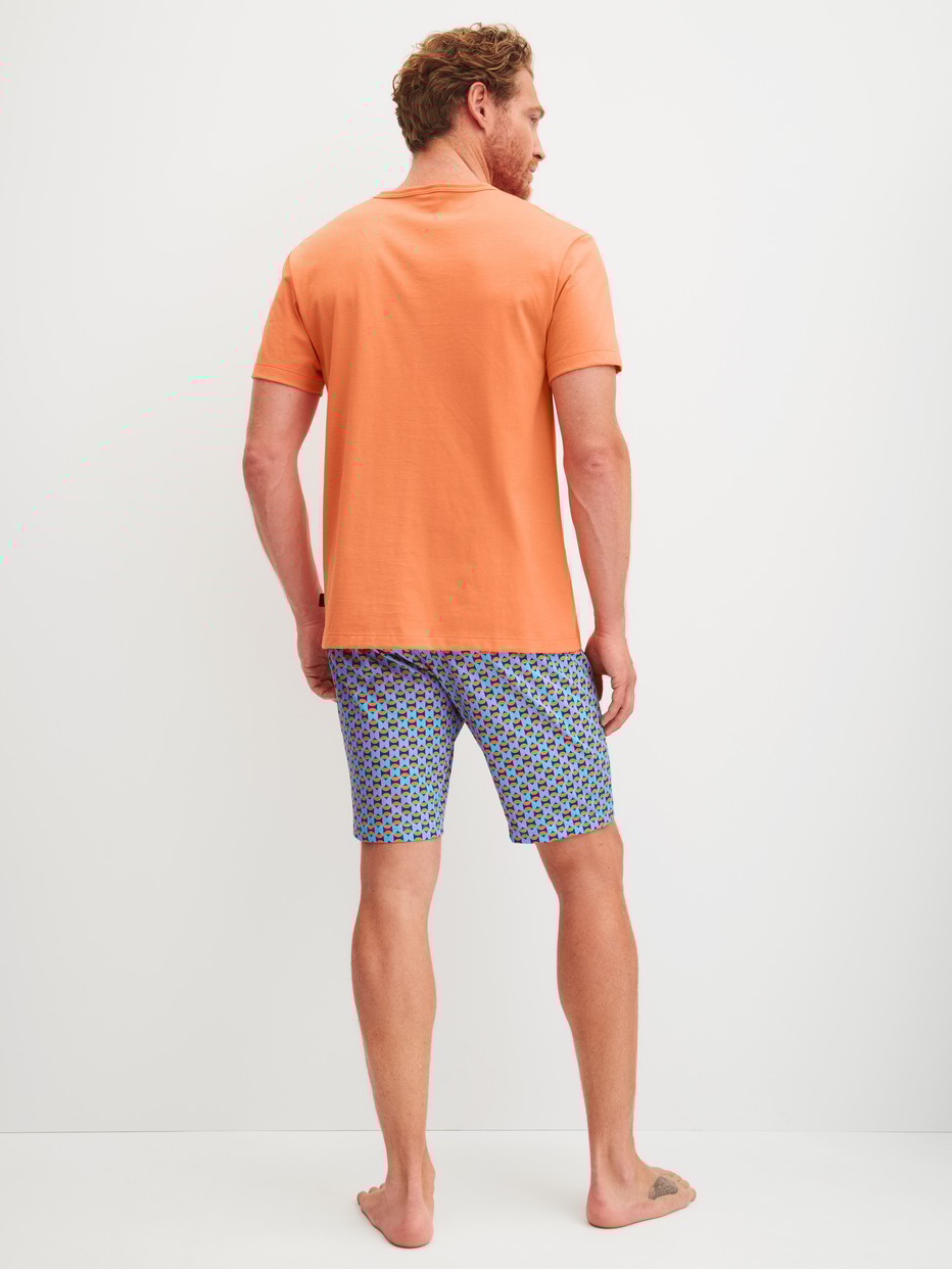 Men model is wearing Short pyjama made of 100% Cotton in Orange, Patterned from the Relax Imprint 4 series by CALIDA, Back view