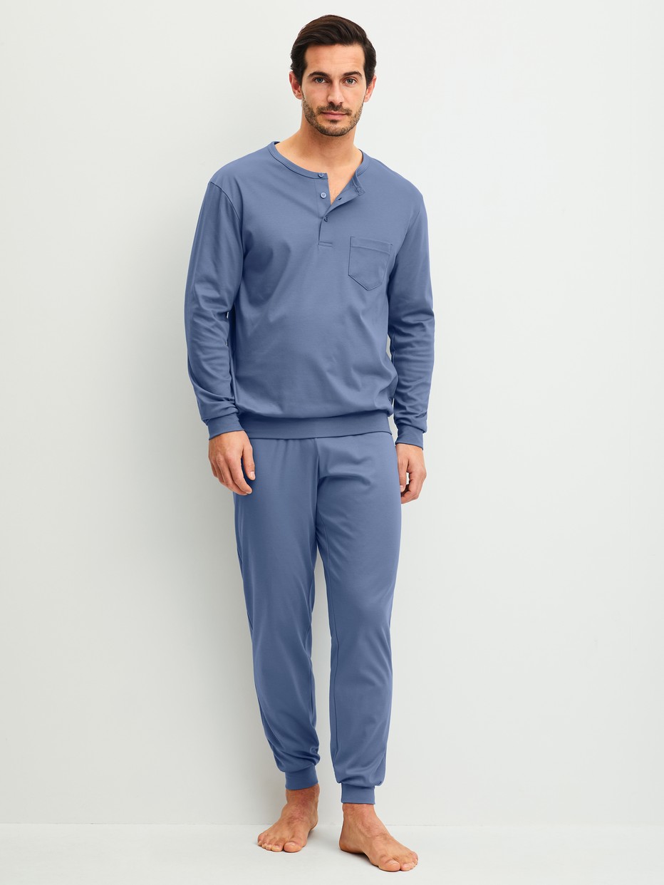 Men model is wearing cuffed pyjamas made of 100% Cotton in Blue, Unicoloured from the Relax Choice 1 series by CALIDA, Front view