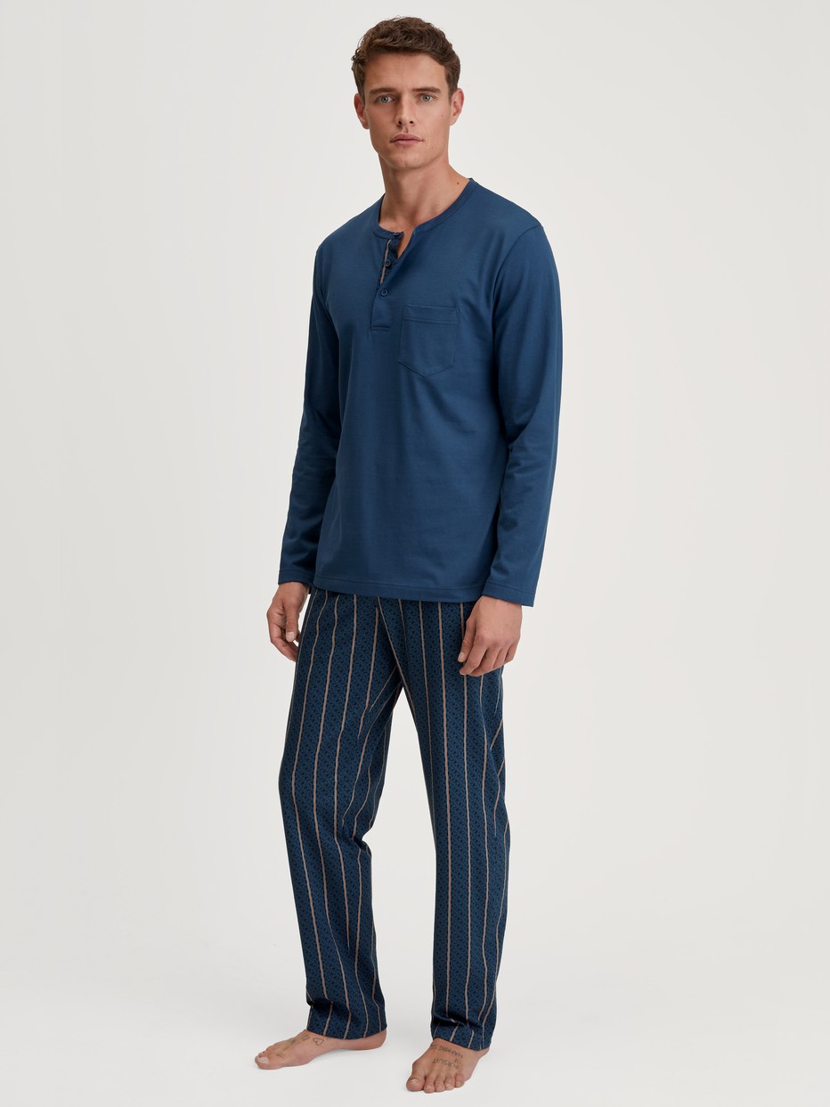 Men model is wearing Pyjamas, long made of 100% Cotton in Blue, Striped from the Relax Imprint 1 series by CALIDA, Front view