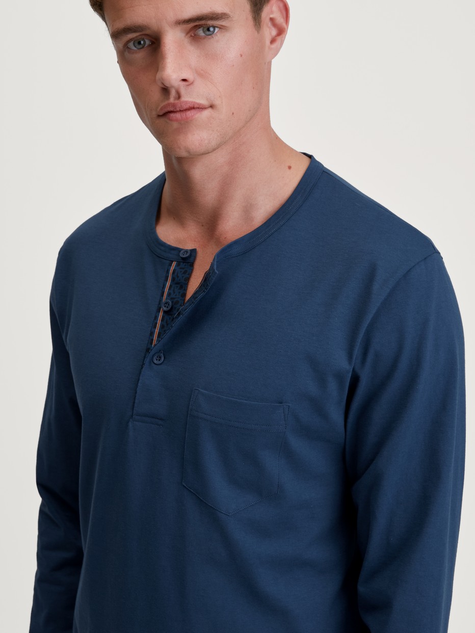 Men model is wearing Pyjamas, long made of 100% Cotton in Blue, Striped from the Relax Imprint 1 series by CALIDA, Detail