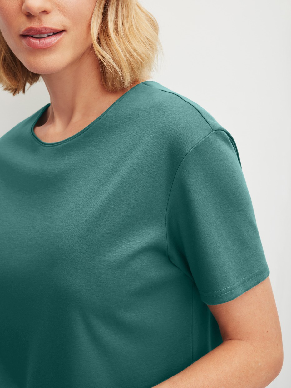 Women model is wearing 7/8 - Pyjamas made of 100% Cotton in Turquoise, Floral from the Botanic Dreams series by CALIDA, Detail