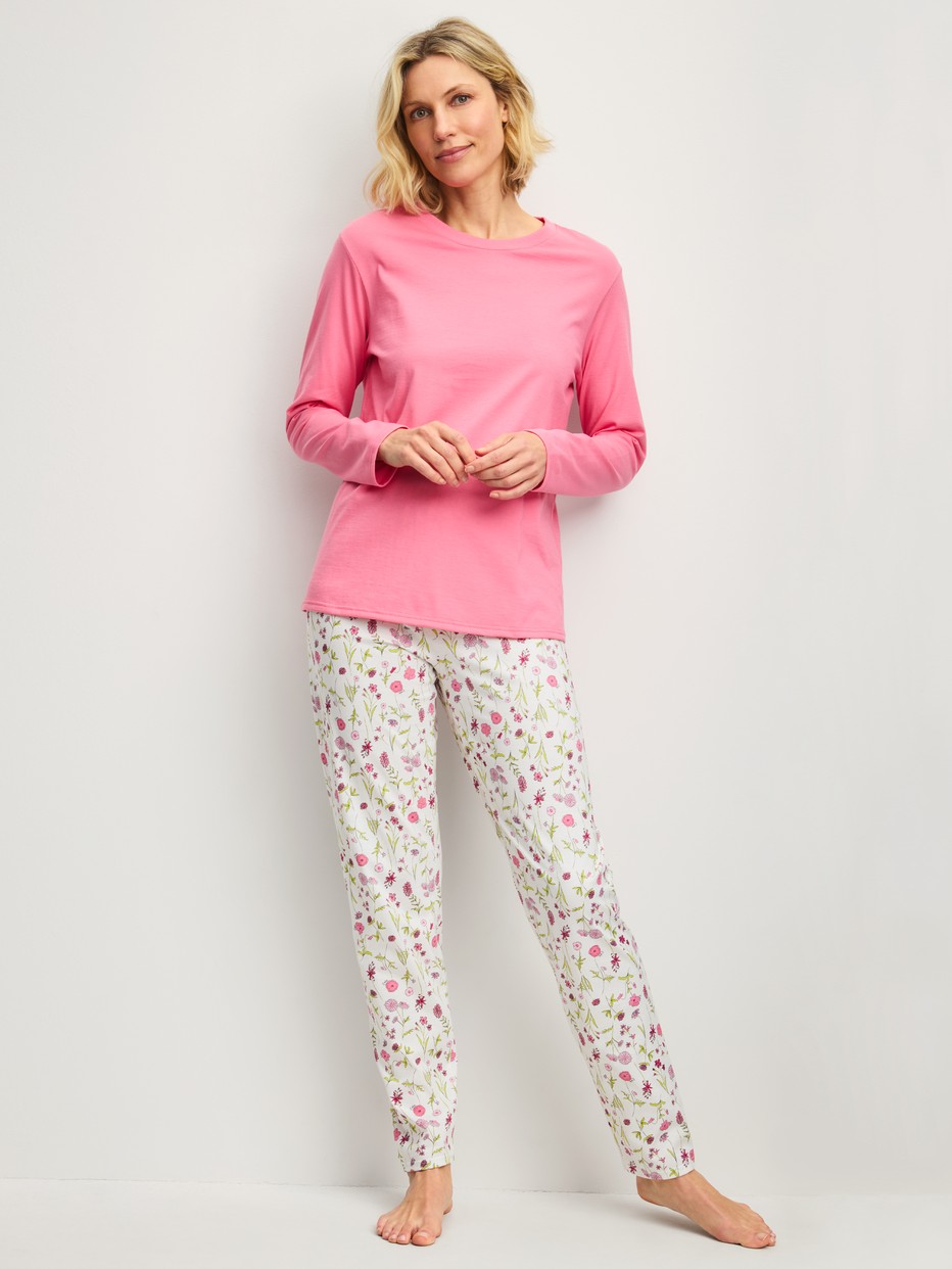 Women model is wearing Pyjamas, long made of 100% Cotton in Pink, Patterned from the Cotton Special series by CALIDA, Front view