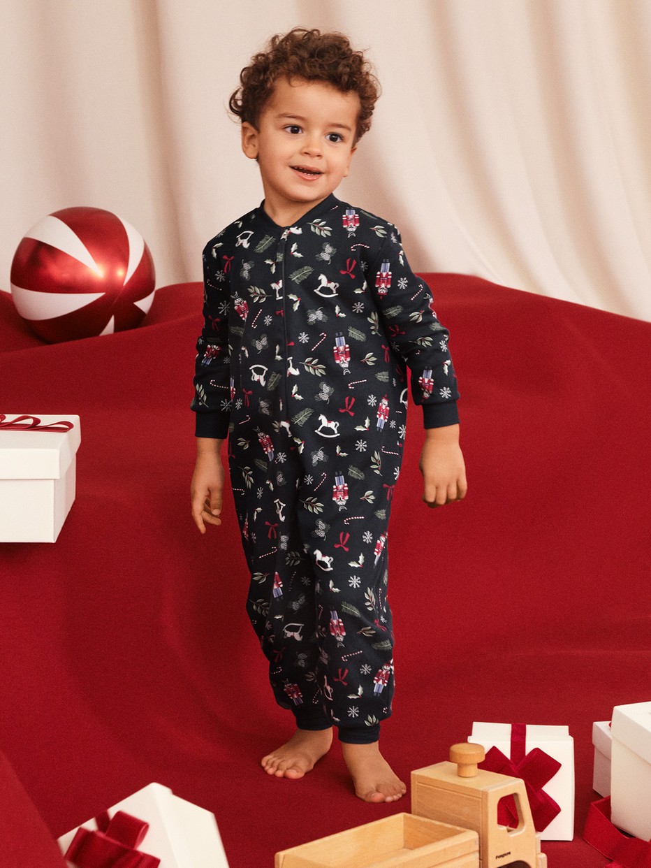 Kids model is wearing Jumpsuit made of 100% Cotton in Blue, Patterned from the Family & Friends series by CALIDA, Front view